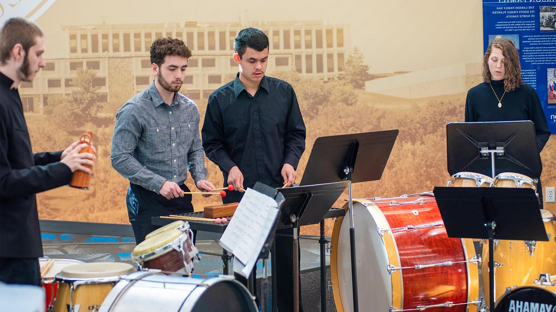 Students playing precussion instruments in the Lumen Vitae Center